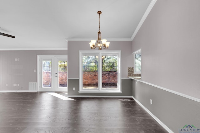 interior space with french doors, dark wood-type flooring, ceiling fan with notable chandelier, and ornamental molding