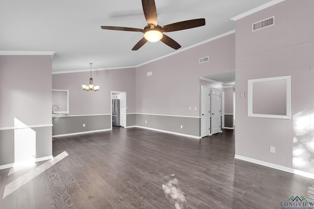 unfurnished living room featuring crown molding, dark hardwood / wood-style flooring, and ceiling fan with notable chandelier