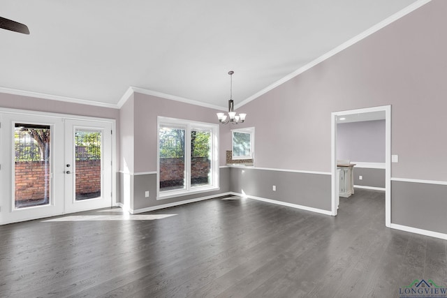 spare room with dark hardwood / wood-style floors, vaulted ceiling, a wealth of natural light, and ornamental molding