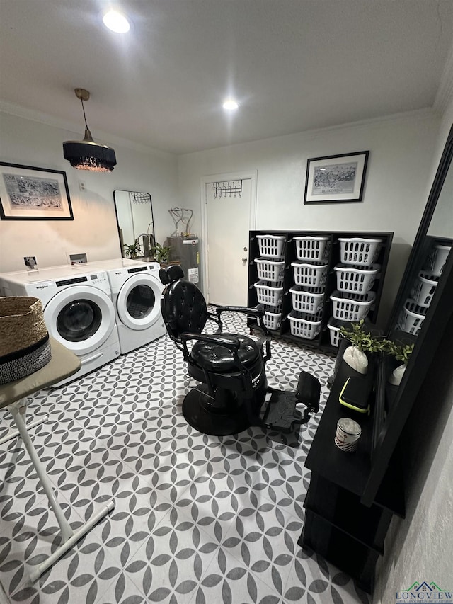 laundry room with ornamental molding, water heater, and washer and dryer