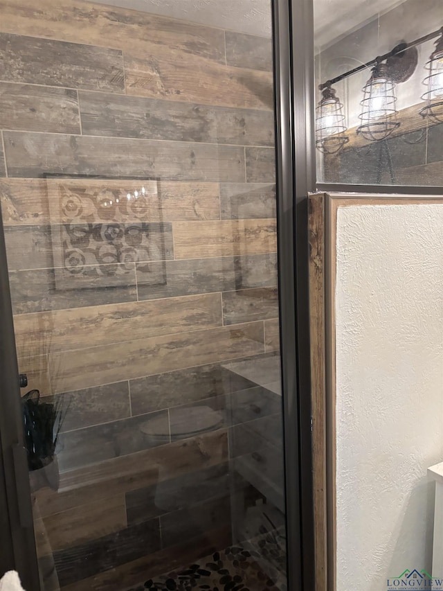 bathroom featuring an enclosed shower