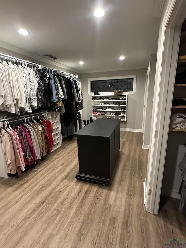 spacious closet featuring hardwood / wood-style flooring