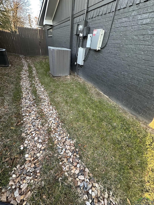 view of yard with central air condition unit