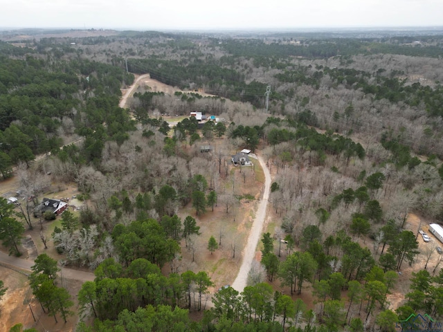 birds eye view of property with a wooded view