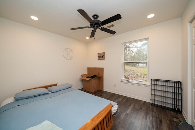 bedroom featuring recessed lighting, wood finished floors, visible vents, and baseboards