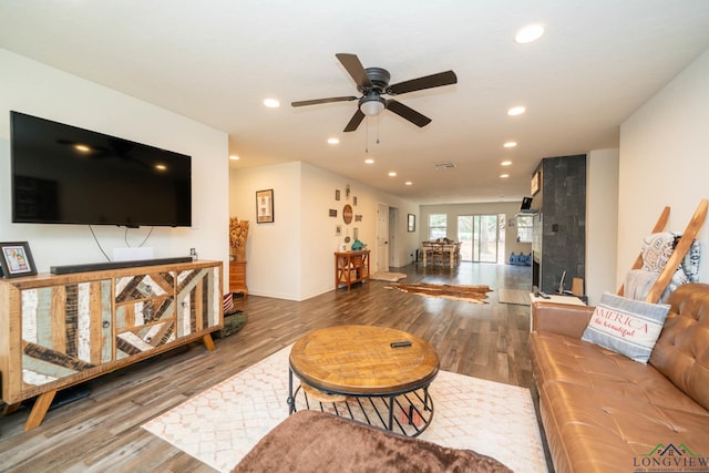 living area featuring recessed lighting, wood finished floors, visible vents, and ceiling fan