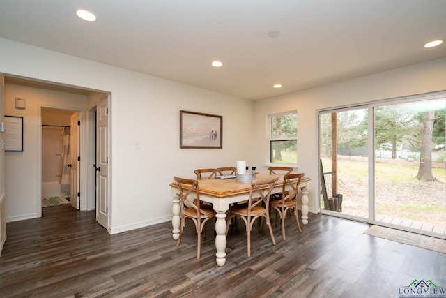 dining room with recessed lighting, baseboards, and dark wood-style floors