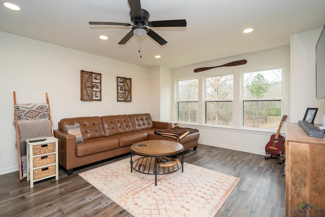 living room with dark wood-style floors, recessed lighting, and baseboards