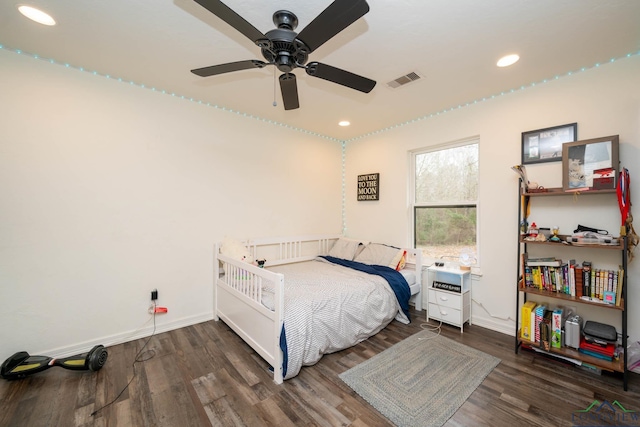 bedroom featuring recessed lighting, wood finished floors, and baseboards