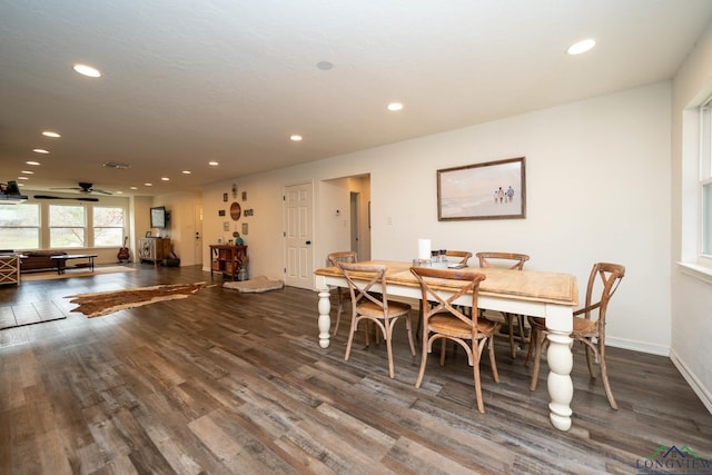 dining space with dark wood finished floors, visible vents, recessed lighting, and baseboards