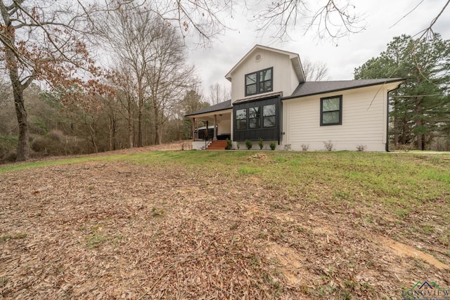 3381 Noonday Rd, Hallsville, TX 75650 - view of front of property with roof with shingles, a front yard, and a porch