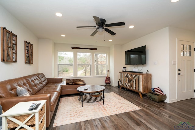 living room with recessed lighting, baseboards, and dark wood-style flooring