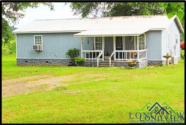 292 J J Craver Rd, Harleton, TX 75651 - view of front of property featuring a porch, a front lawn, metal roof, and crawl space