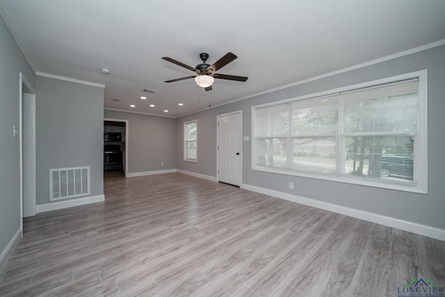 unfurnished living room with ceiling fan, light hardwood / wood-style floors, and ornamental molding