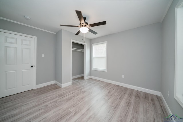 unfurnished bedroom featuring ceiling fan, a closet, and light hardwood / wood-style flooring