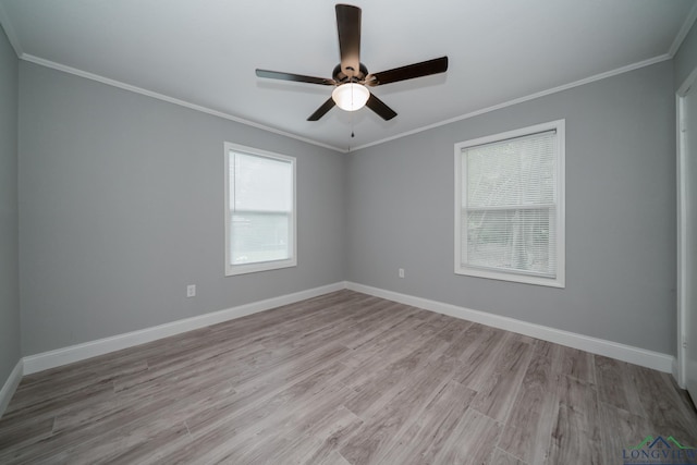 spare room featuring ceiling fan, light hardwood / wood-style flooring, and ornamental molding