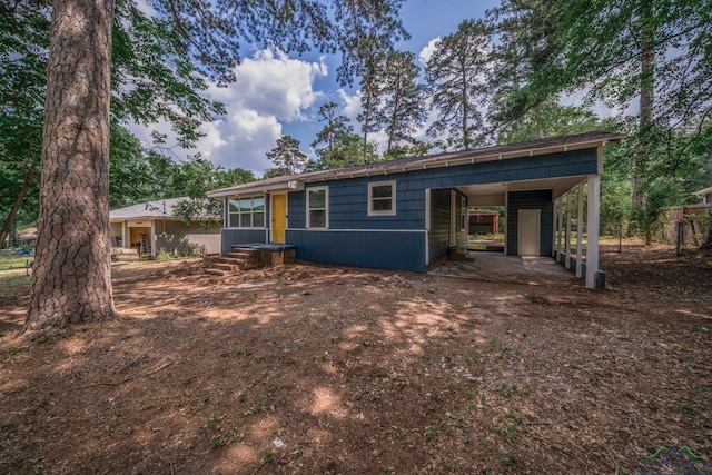 view of front of property with a carport