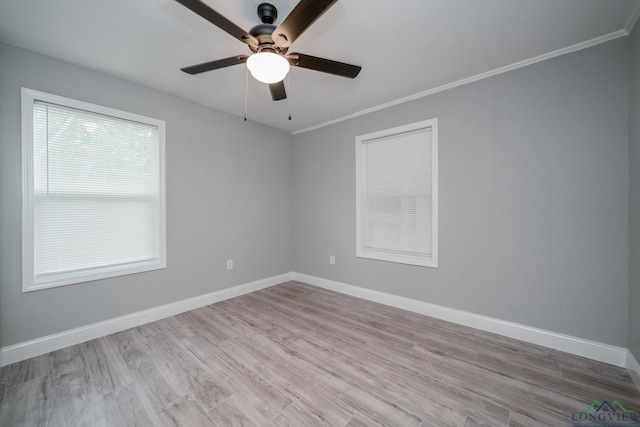 unfurnished room featuring light hardwood / wood-style floors, ceiling fan, and crown molding