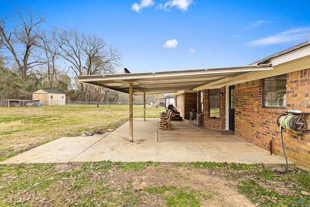 view of patio featuring a carport and a fenced backyard