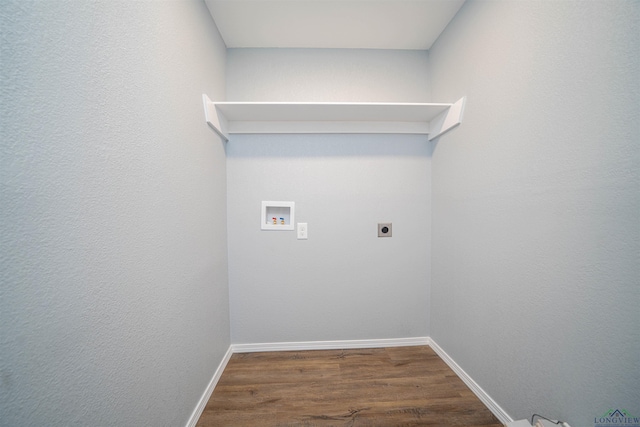 18385 Fm 1716, Tatum, TX 75691 - washroom with hookup for a washing machine, electric dryer hookup, wood finished floors, and baseboards