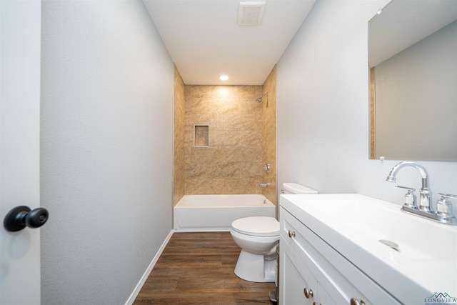 18385 Fm 1716, Tatum, TX 75691 - full bath featuring toilet, vanity, bathing tub / shower combination, wood finished floors, and baseboards