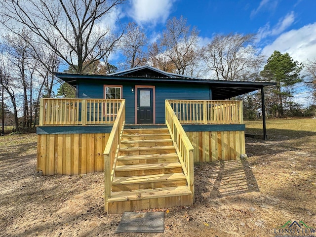 view of front of home with a wooden deck