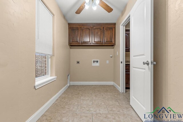 laundry area with electric dryer hookup, cabinet space, light tile patterned floors, baseboards, and hookup for a washing machine