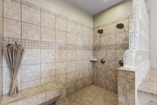 bathroom featuring tiled shower