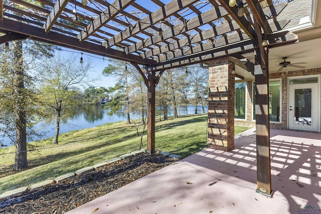 view of patio with ceiling fan, a water view, and a pergola