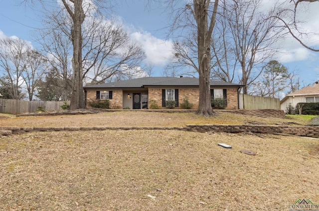 single story home with a front lawn