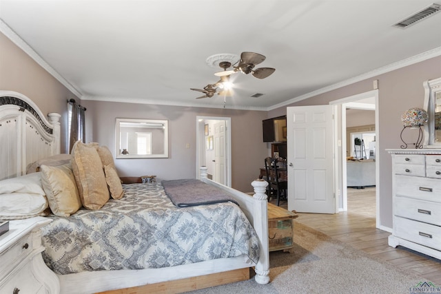 bedroom with wood-type flooring, ornamental molding, and ceiling fan