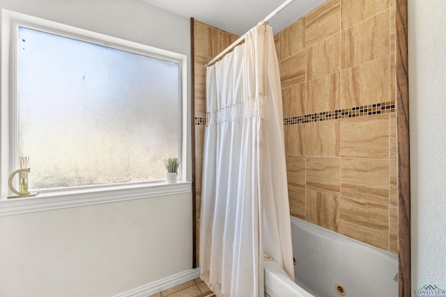 bathroom with shower / bath combo with shower curtain