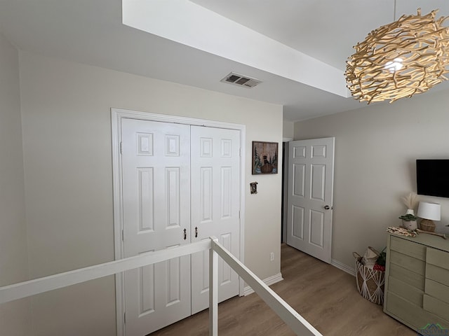 interior space with a closet and hardwood / wood-style flooring