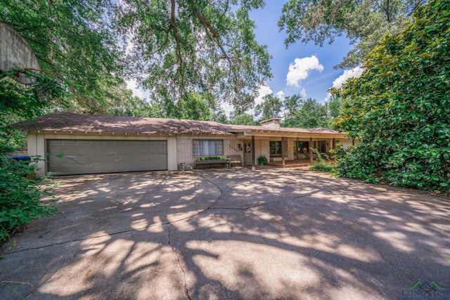 ranch-style house featuring a garage