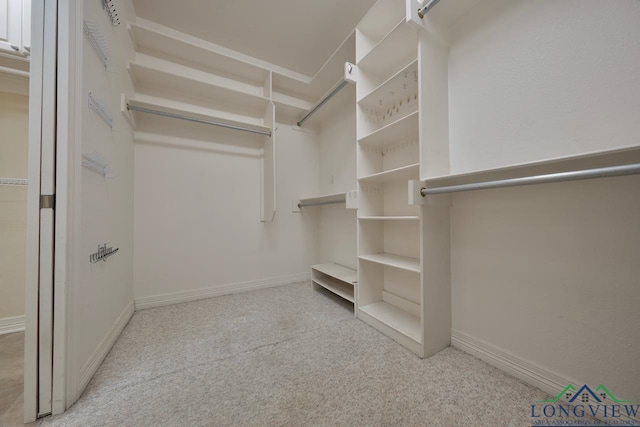 521 Hideaway Ln, Central, Hideaway, TX 75771 - spacious closet featuring carpet floors