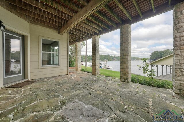 521 Hideaway Ln, Central, Hideaway, TX 75771 - view of patio / terrace with a water view