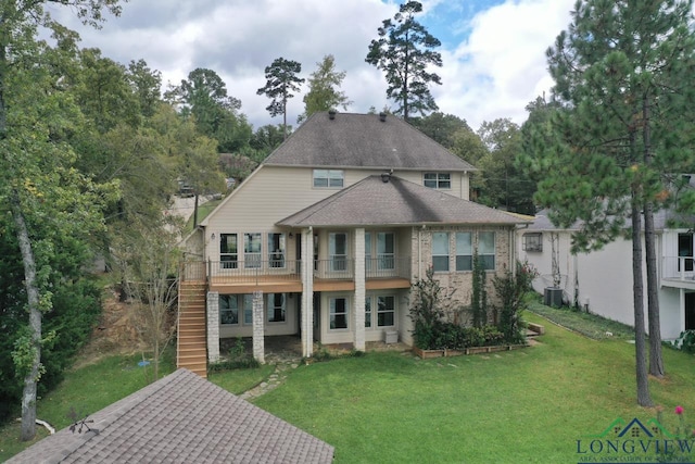 521 Hideaway Ln, Central, Hideaway, TX 75771 - view of front facade with a shingled roof, central air condition unit, a front lawn, and stairs