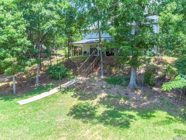 view of yard with covered porch