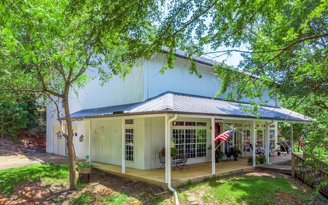 back of house with a patio