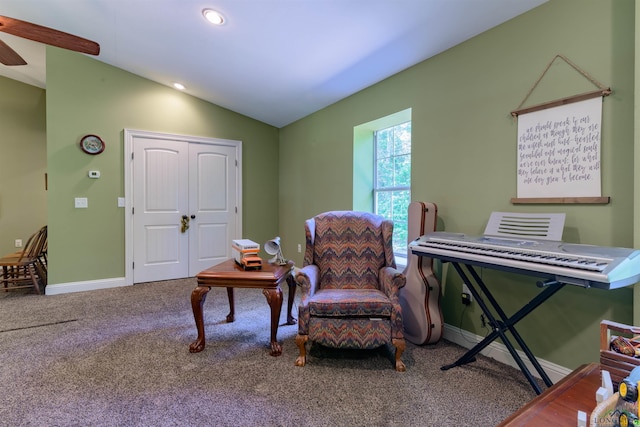 living area with carpet flooring and vaulted ceiling