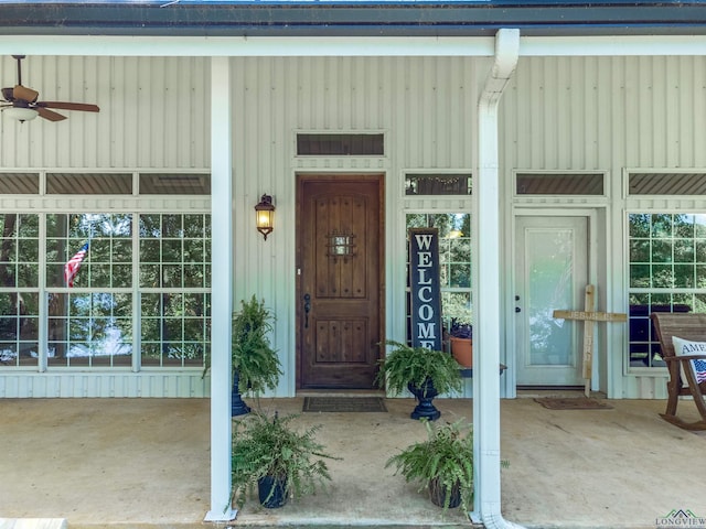 property entrance with ceiling fan