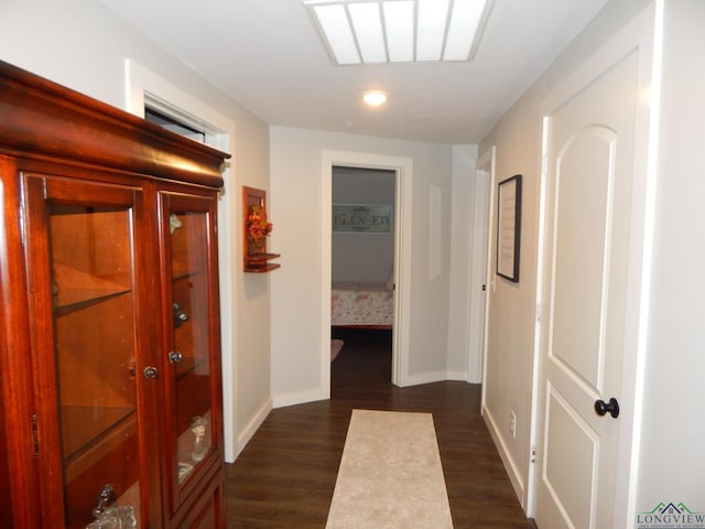 hall with dark wood-type flooring