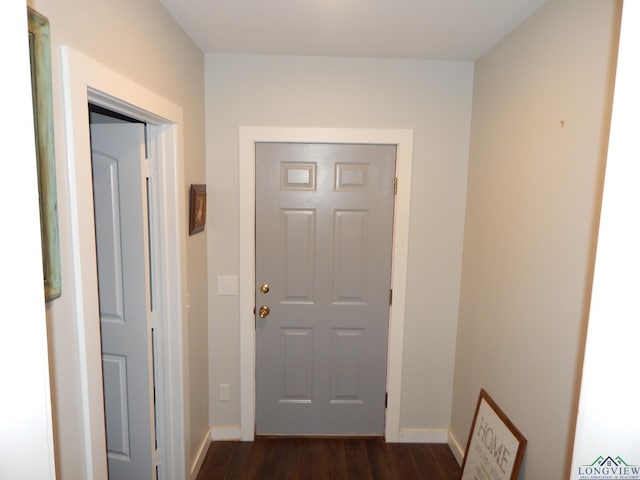 doorway with dark wood-type flooring