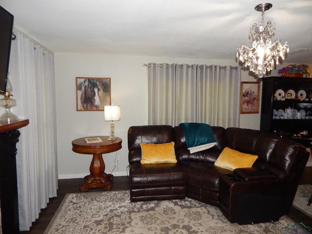 living room featuring hardwood / wood-style flooring and a notable chandelier