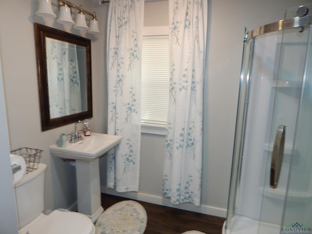 bathroom featuring sink, toilet, wood-type flooring, and walk in shower