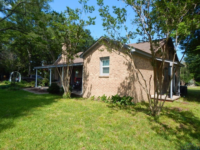 view of home's exterior featuring a lawn