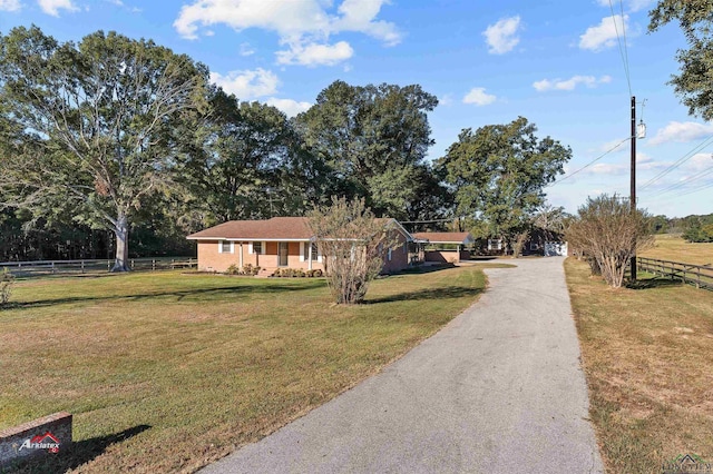 single story home with a front yard