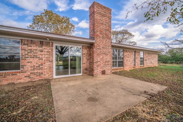 rear view of house with a patio