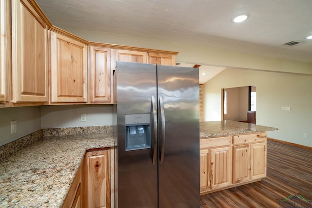 kitchen featuring dark hardwood / wood-style flooring, stainless steel refrigerator with ice dispenser, and light brown cabinets