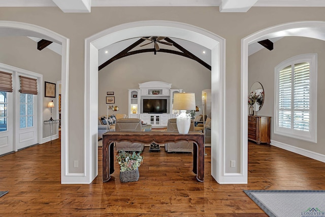 entryway featuring lofted ceiling with beams, hardwood / wood-style floors, and ceiling fan